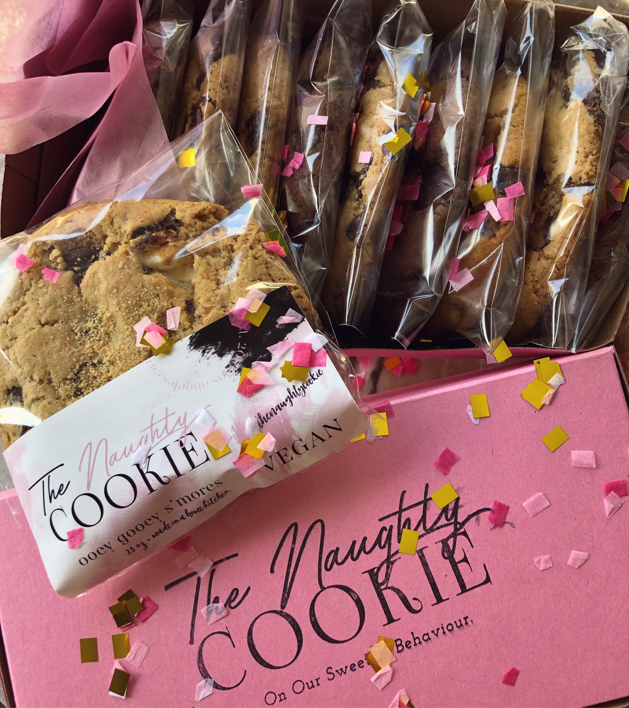 The Naughty Cookie Vegan Cookie Collage Box with confetti in our Signature Pink Box